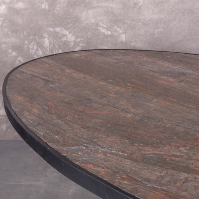 Eettafel van steen fineer. Ovaal 200cm met zwarte spinpoot.
