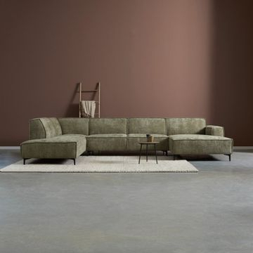 Sfeerafbeelding van de hoekbank River in het groen en u-opstelling. 