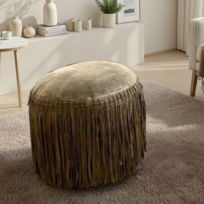 Groene poef met franjes. 