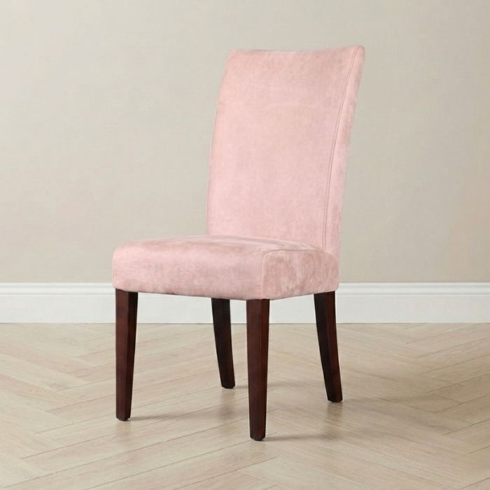 Roze eetkamerstoel met lederlookstof. 
