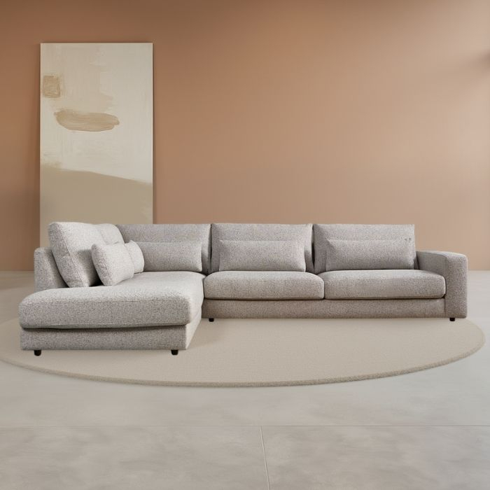 Grijs hoekbankstel met ligdeel en losse kussens